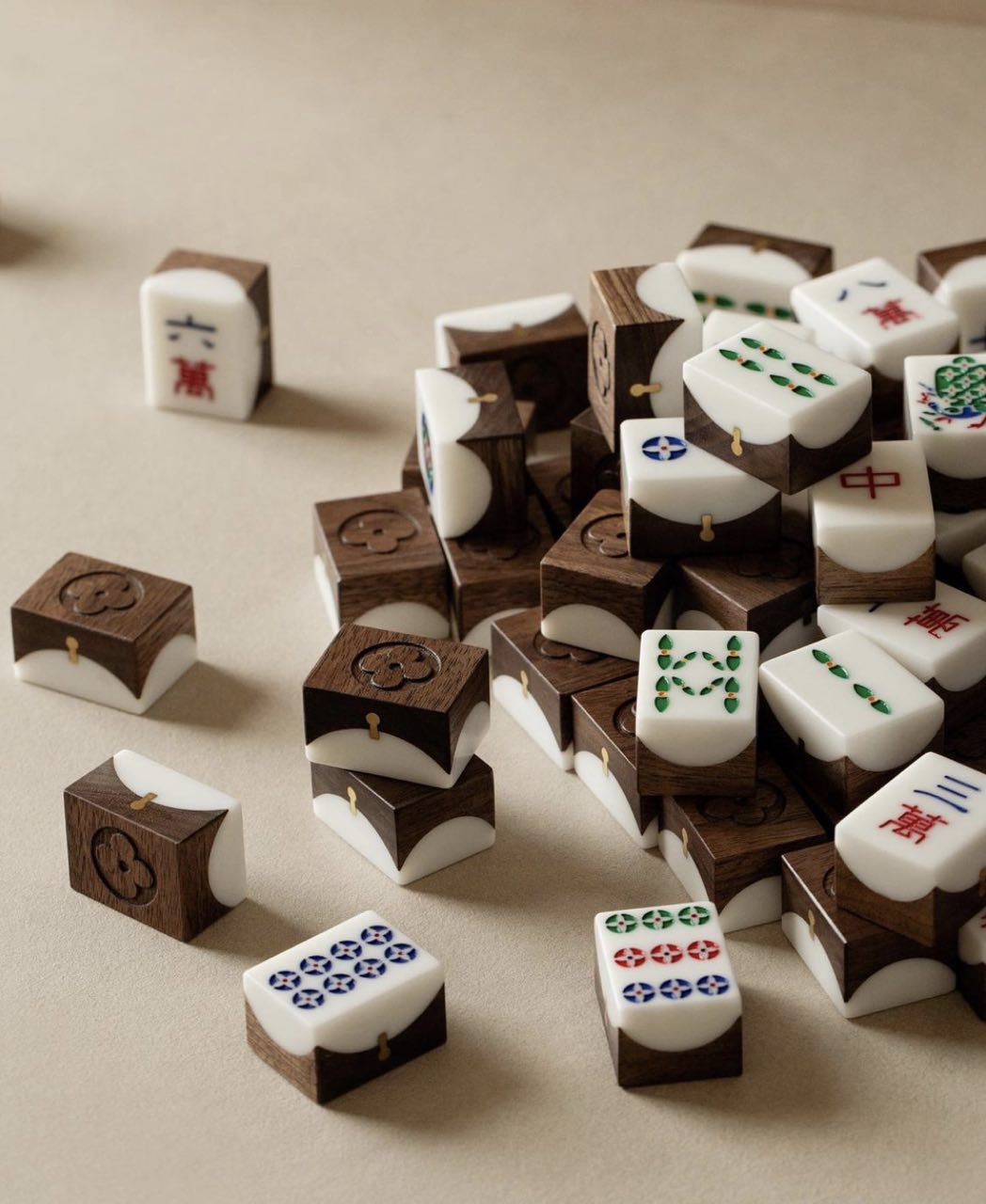 Hand-carved wood & stone mahjong set by Louis Vuitton selling for